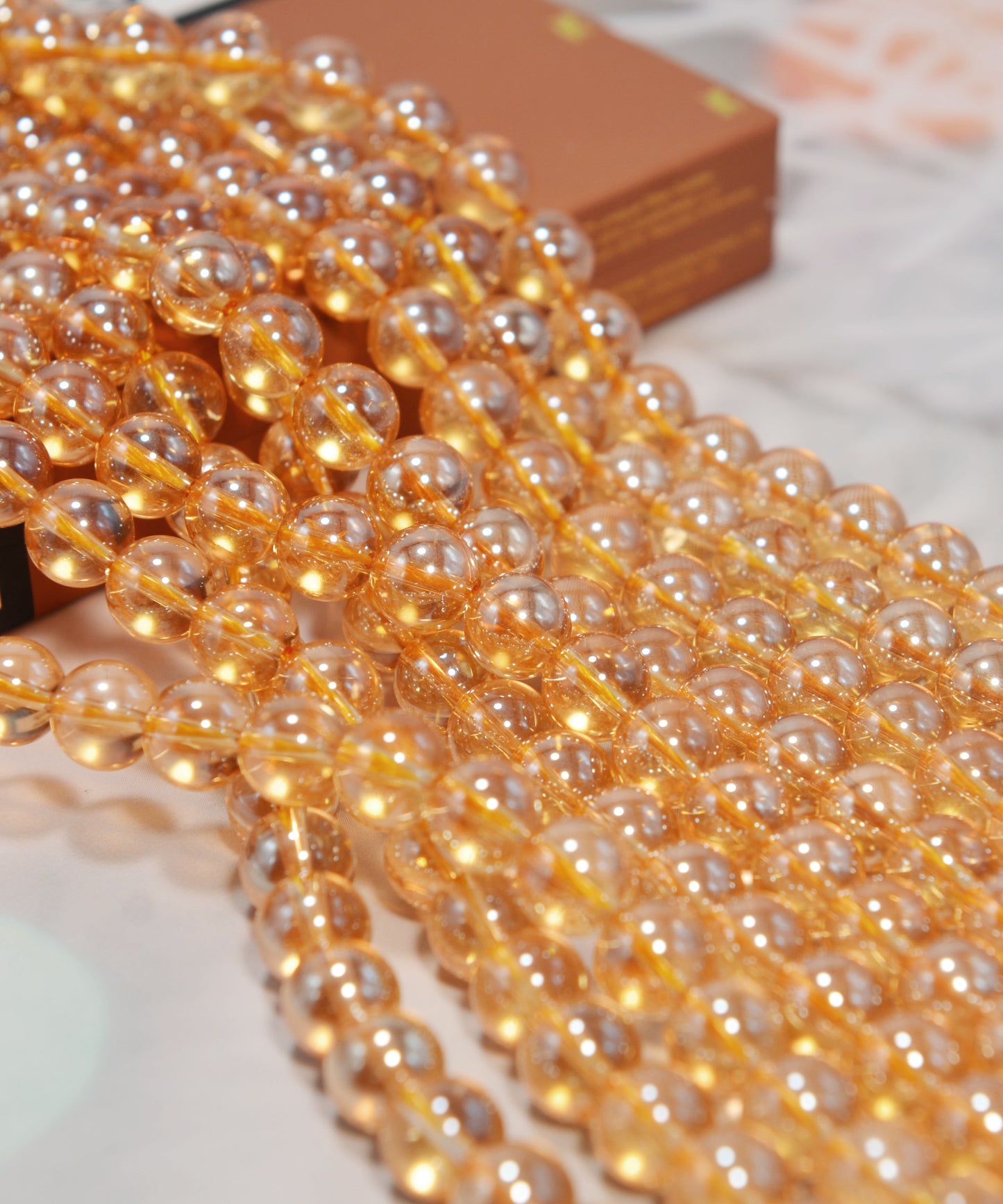 天然水晶ビーズ オーロラメッキ加工 オレンジ系 8㎜ (1連)