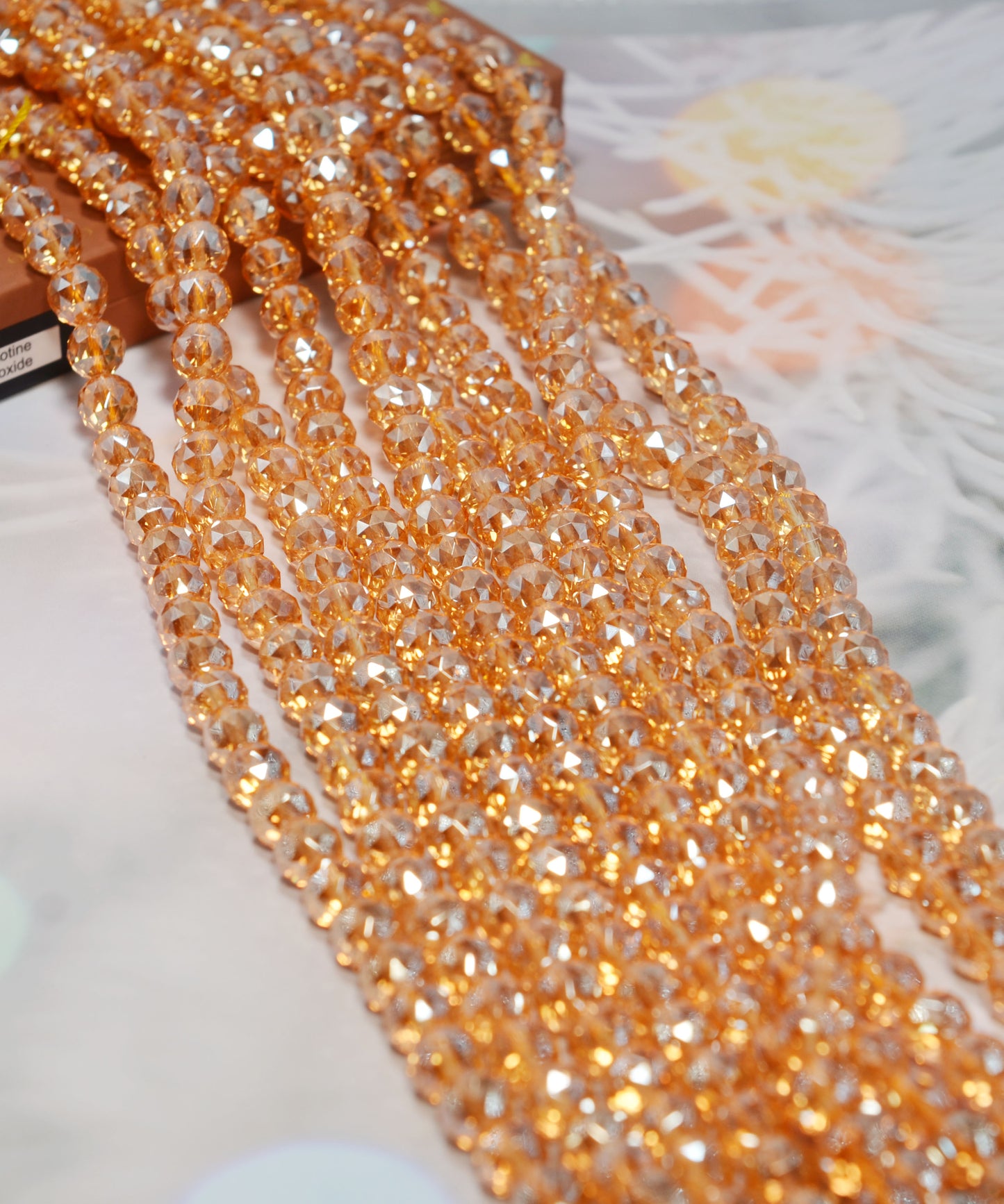 天然水晶ビーズ  多面カット オーロラメッキ加工 オレンジ系 8㎜ (1連)